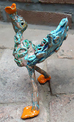 Bronze, bronze sculpture of a bird through a lure is looking for his partner, a trumpet bird