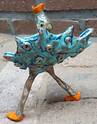 Bronze, bronze sculpture of a bird through a lure is looking for his partner, a trumpet bird